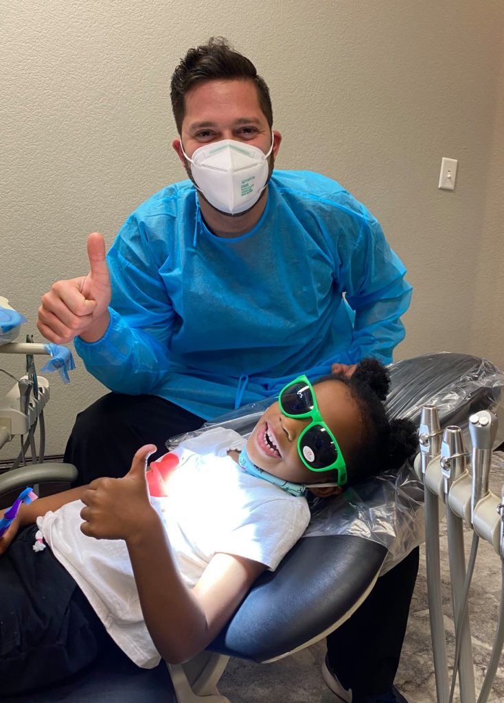 Pediatric dentist in Arlington TX with a patient