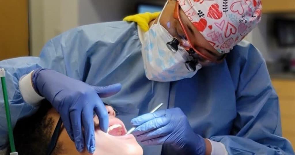 Surgical orthodontist in Texas performing oral surgery on a patient