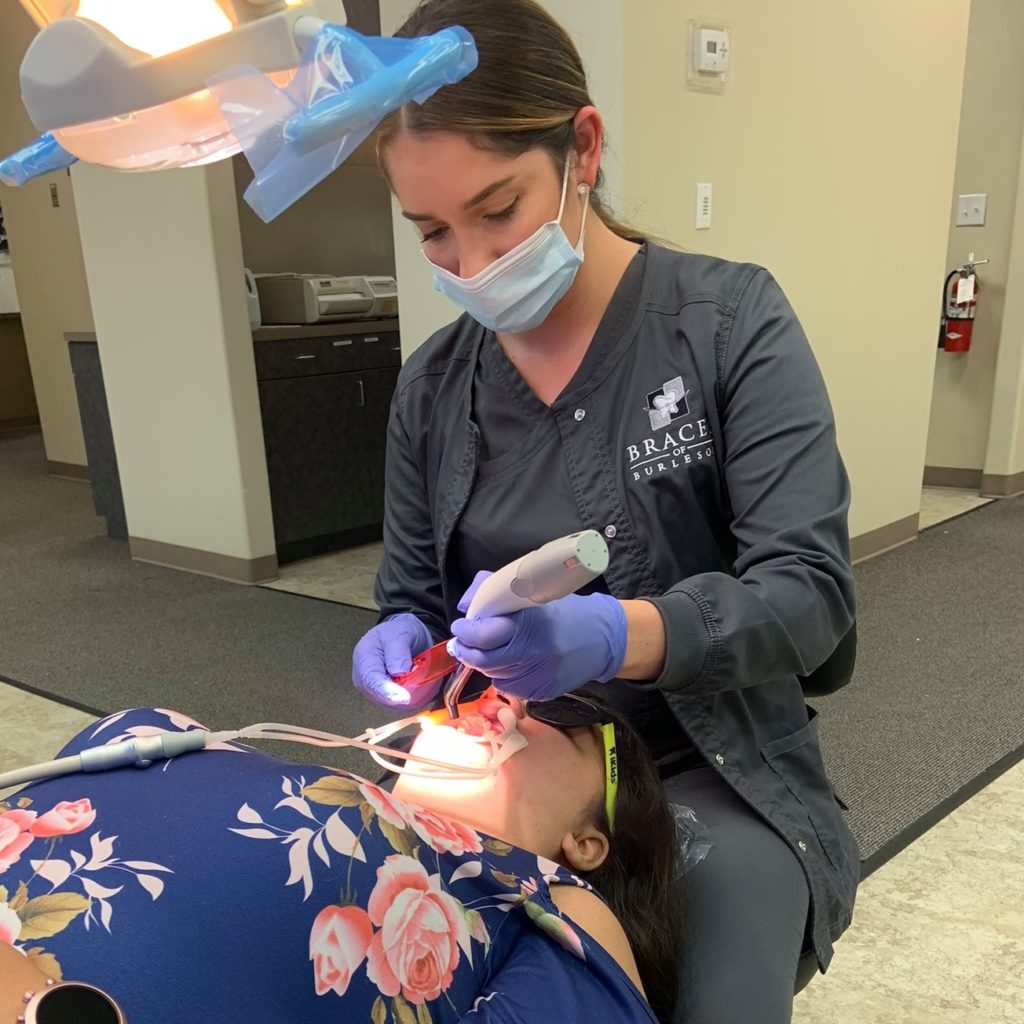 Orthodontist in Burleson Texas with a patient